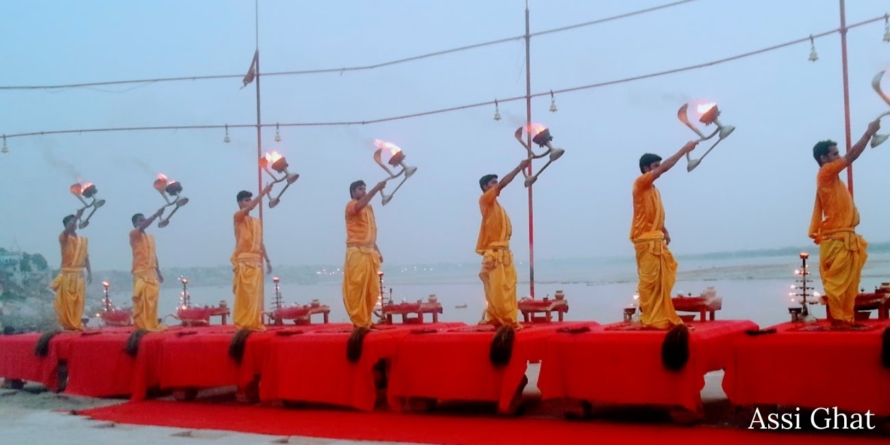 Priest are doing morning aarti at Assi Ghat in Varanasi